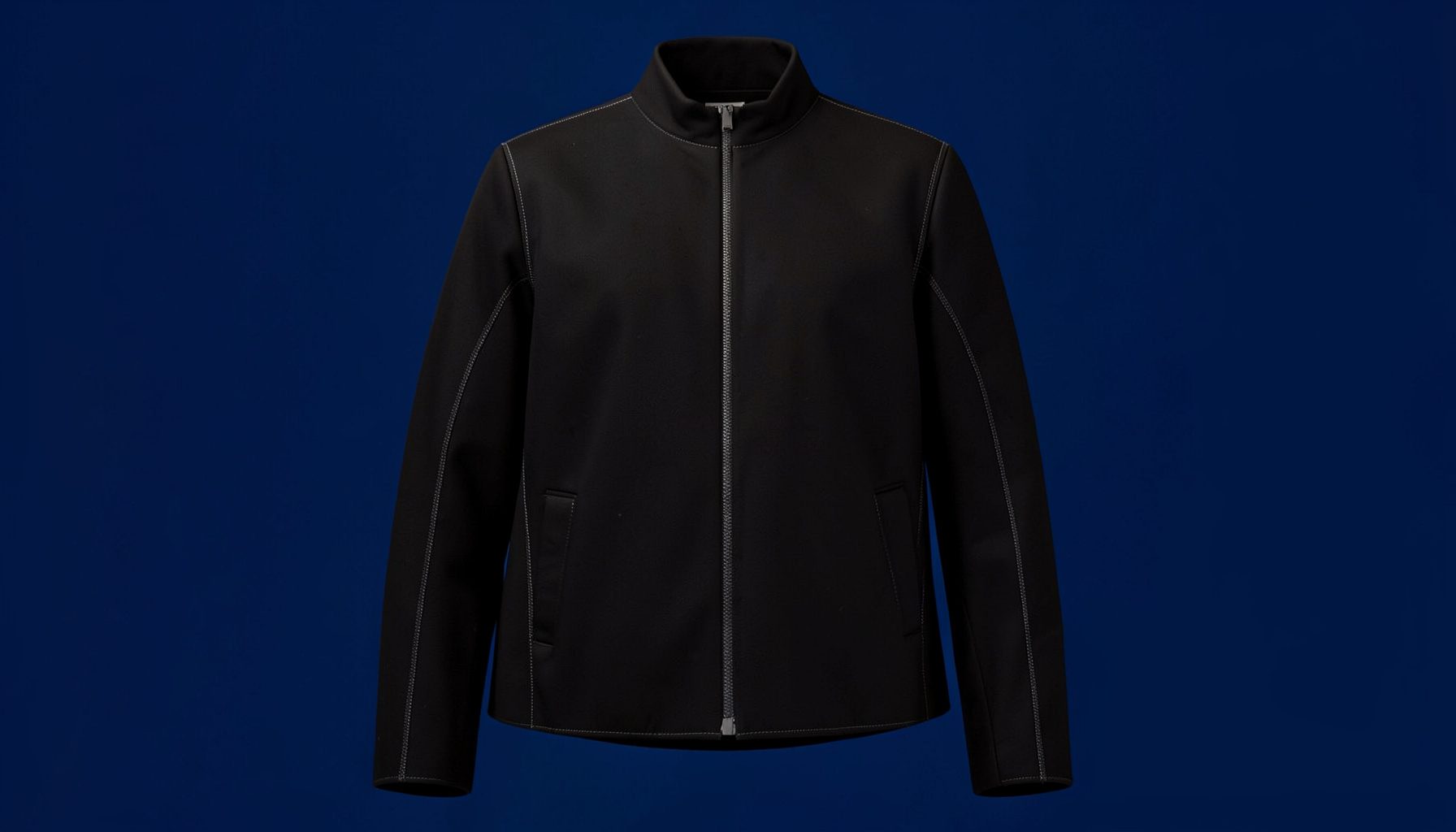 Black outerwear fabric with tonal stitching, understated and sleek, dark monochrome palette